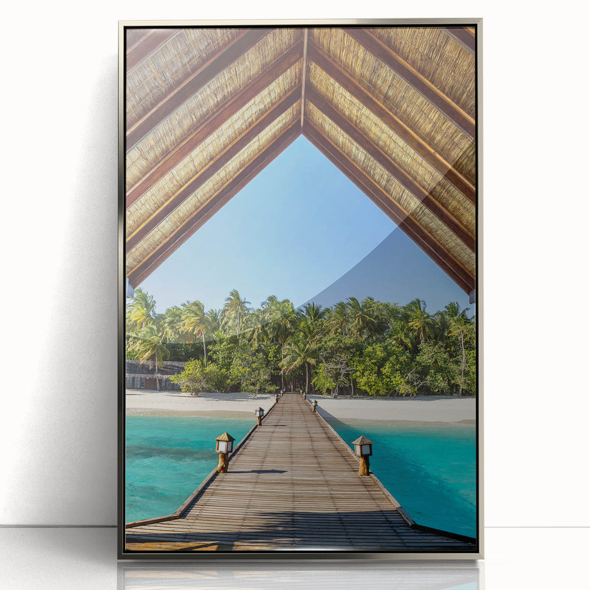 Mid-century modernist art of Tahitian scenery in silver-framed acrylic, featuring lush greenery and ocean views.