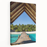 Side view of a stretched canvas depicting a serene Tahitian beach scene, with vibrant blue and green tones.