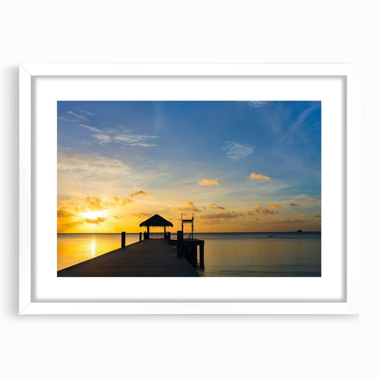 Abstract art print of Micronesian scenery in muted blue and green tones on a framed canvas.