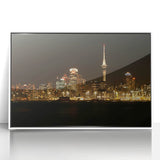 Framed acrylic print of Auckland skyline in muted gray and blue tones, suitable for modern art wall decor.