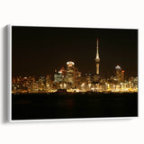 Vintage poster art of Auckland skyline in vibrant colors on a large framed canvas, ideal for living room decor.