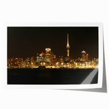 Rolled print of Auckland, New Zealand scenery with floral elements in soft color tones.