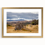 Textured abstract art print of Otago, New Zealand scenery in gold frame, ideal for bedroom wall decor.