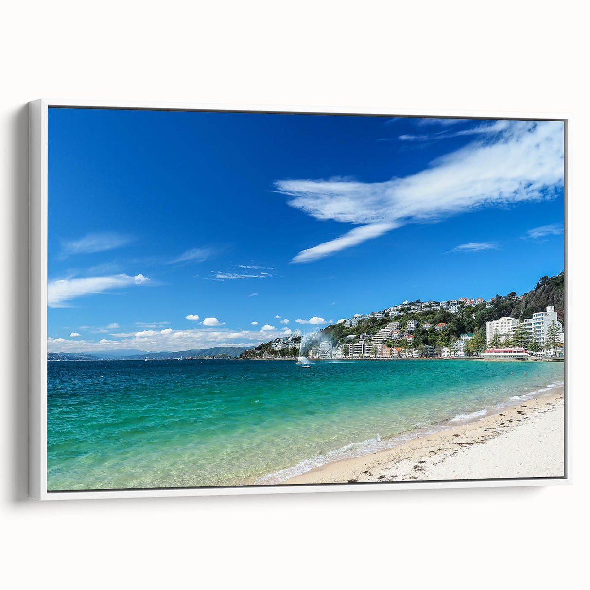 Framed canvas featuring a vintage poster art of Wellington, New Zealand, with colorful accents on a black background.