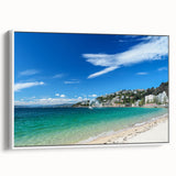 Framed canvas featuring a vintage poster art of Wellington, New Zealand, with colorful accents on a black background.
