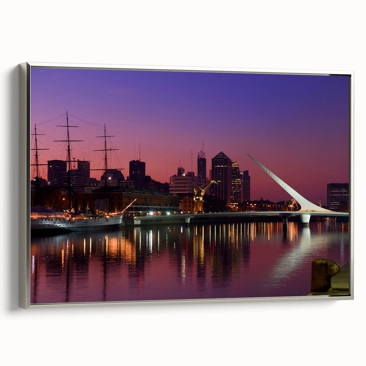 Framed canvas featuring a vintage-style landscape painting of Buenos Aires with colorful art on a black background.