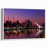Vintage poster art of Buenos Aires in colorful tones on a framed canvas, ideal for living room decor.