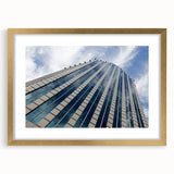 Extra large abstract art print of Santiago skyline in textured hues of gold and blue, framed with a mat.