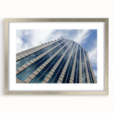 Textured art of abstract Santiago skyline in muted earth tones on a framed silver mat, suitable for bedroom decor.