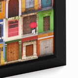Extra large framed canvas featuring a textured depiction of a South American scenery in black with colorful accents.