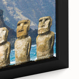 Easter Island statues depicted in textured, colorful art on a large black framed canvas, ideal for living room decor.