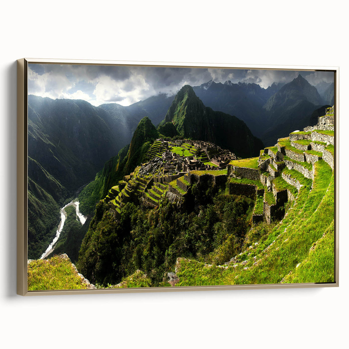 Framed canvas wall art featuring a vintage-style landscape painting of Machu Picchu in muted gold and black tones.
