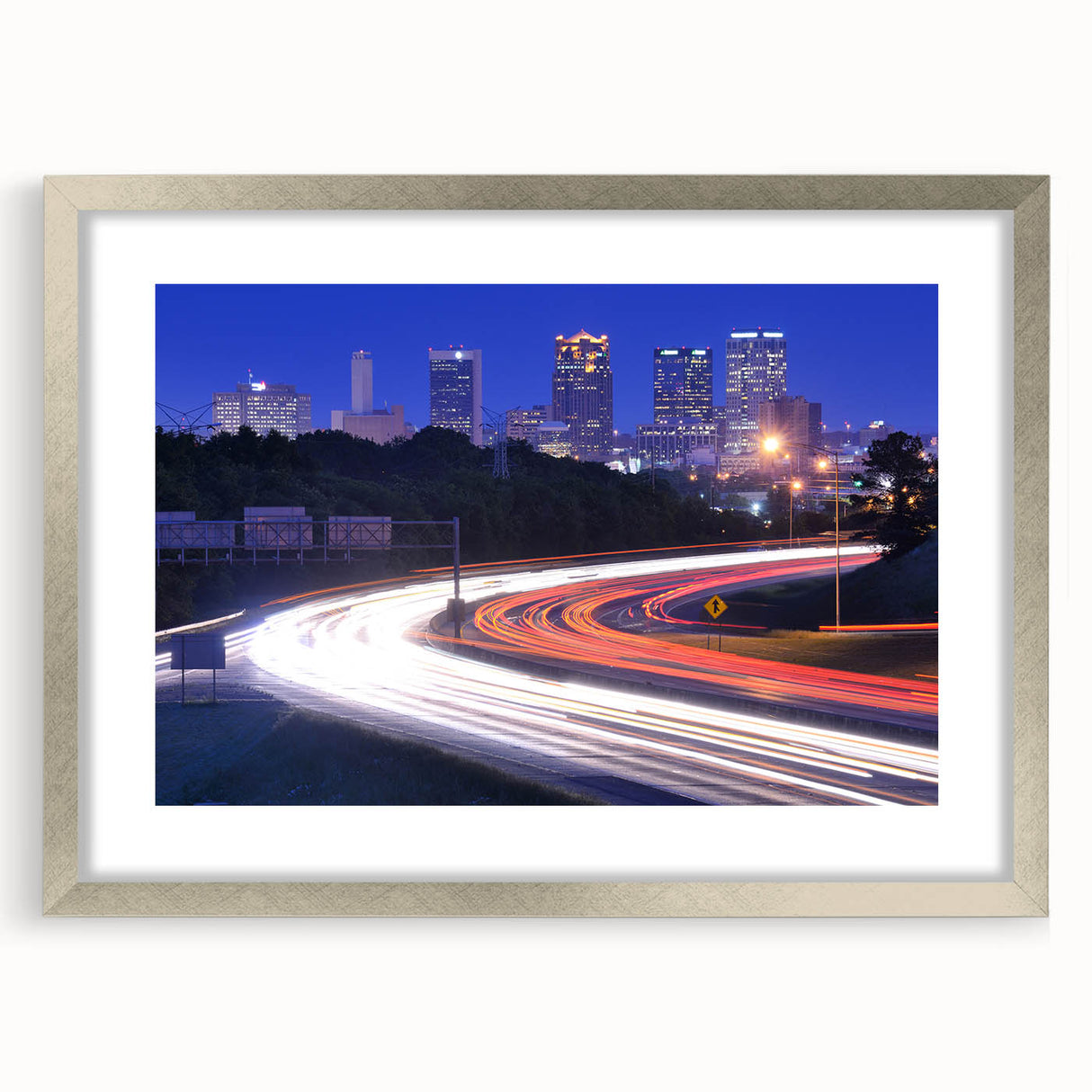Textured abstract art print of Alabama scenery in muted earth tones, framed in silver, ideal for bedroom decor.