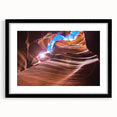 Extra large textured abstract art print of Arizona Antelope Canyon in vibrant red and orange hues, framed in black.