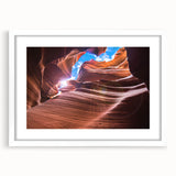 Abstract art print of Antelope Canyon in Arizona, featuring rich orange and red tones on a framed white mat.