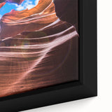 Close-up of a framed canvas depicting Antelope Canyon in Arizona, featuring textured black and colorful art.