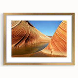 Extra large abstract art print of Arizona's Coyote Buttes in textured style, with muted earth tones, framed in gold.