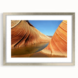 Textured art print of Arizona's Coyote Buttes in muted earth tones, framed in silver, ideal for bedroom decor.