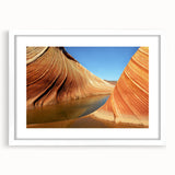 Abstract art print of Arizona's Coyote Buttes in muted earth tones on a framed white mat.