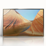 Mid-century modernist art depicting the Coyote Buttes in Arizona, in earthy tones on a silver-framed acrylic print.