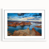 Abstract art print of Lake Powell in muted blue and orange tones on a framed white mat, ideal for dining room decor.
