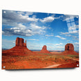 Acrylic print of Monument Valley with vivid orange and red tones, suitable for bedroom or dining room decor.