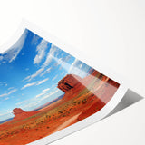 Extra large wall art featuring a panoramic view of Monument Valley in muted earth tones on a rolled print.