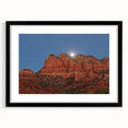 Colorful abstract art print of Sedona landscape in vibrant red and orange tones on a large framed canvas.