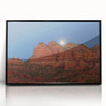 Large abstract wall art depicting the Sedona landscape in vibrant red and orange tones, framed in black acrylic.