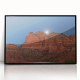 Large abstract wall art depicting the Sedona landscape in vibrant red and orange tones, framed in black acrylic.