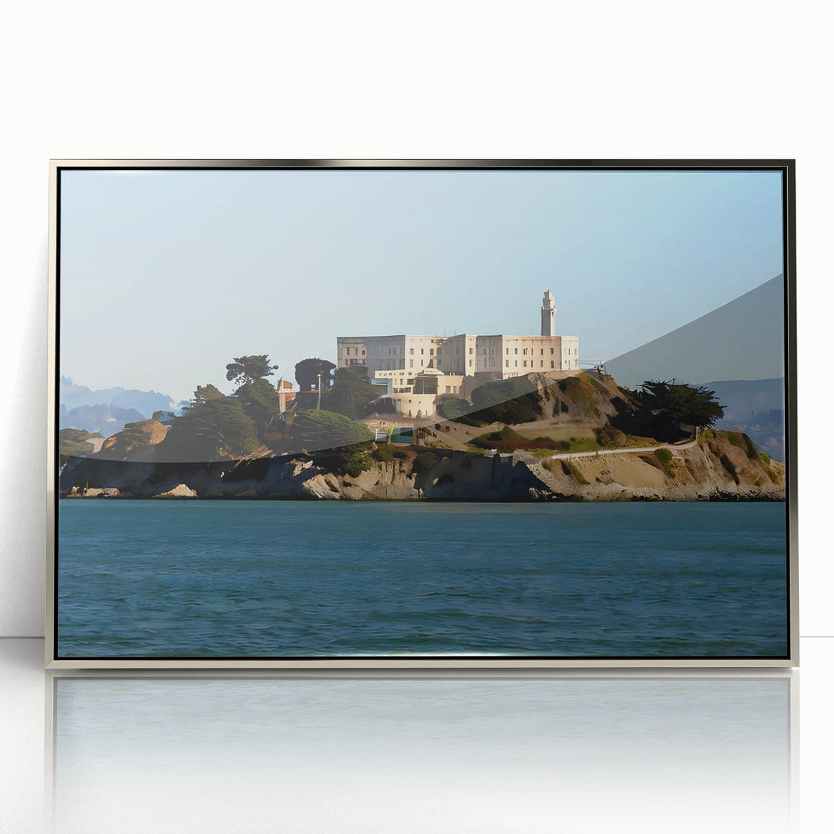 Mid-century modernist art depicting Alcatraz Island in muted blue tones on a framed acrylic print.