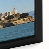 Close-up of a textured black wall art featuring a colorful Alcatraz scene on framed canvas.
