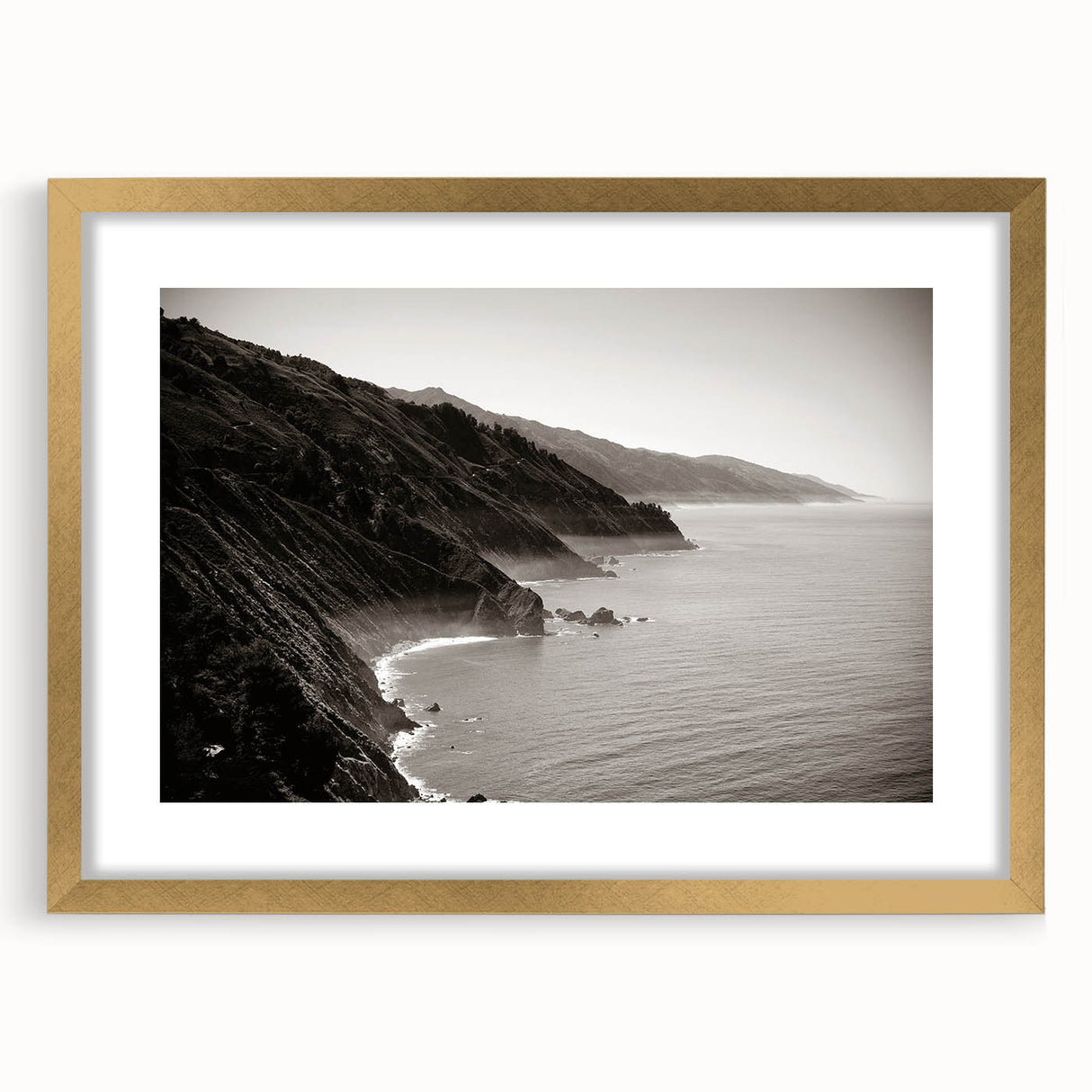 Extra large abstract art print of the Big Sur coastline in textured shades of blue and green, framed in gold.