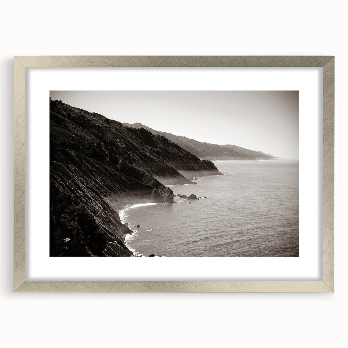 Textured art print of California's Big Sur in muted earth tones on a framed canvas, suitable for bedroom decor.