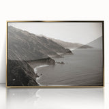 Large acrylic print of Big Sur coastline in gold frame, featuring mid-century modernist style.