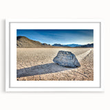 Abstract art print of Death Valley in muted earth tones on a framed white mat, ideal for dining room decor.
