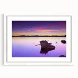 Abstract art print of Lake Tahoe in muted blue and green tones, framed in white, suitable for dining room decor.