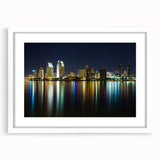 Abstract art print of San Diego skyline in muted blue and white tones, framed with a white mat.