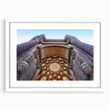 Abstract art print of San Francisco skyline in muted blues and grays, framed with a white mat.