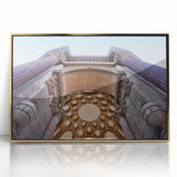 Large art print of San Francisco skyline in gold and blue tones on acrylic, framed, in mid-century modernist style.