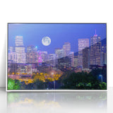 Acrylic print of Denver skyline in pastel shades, framed in white, ideal for modern nursery wall art.