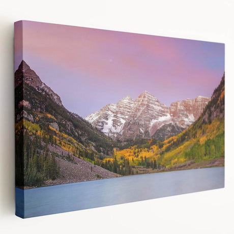 Maroon Bells mountain range with reflective lake in autumn, displayed on large stretched canvas.