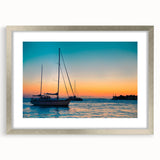 Textured abstract art print of the Florida Keys in muted blue and green tones on a framed canvas, suitable for bedroom decor.