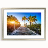 Textured art print of abstract Palm Beach scenery in muted blue and green, framed in silver, suitable for bedroom decor.