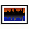 Extra large, colorful abstract art print of the Atlanta skyline with vibrant hues on a textured canvas, framed in black.