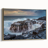 Framed canvas wall art featuring a vintage-style landscape painting of Kauai, with muted gold and black tones.