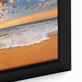 Close-up of a black wall art depicting Oahu's landscape, with vibrant colors on a textured, framed canvas.