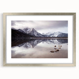 Textured abstract art print depicting Idaho scenery in muted earth tones, framed in silver, ideal for bedroom art.