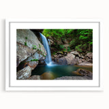 Abstract art print of Kentucky scenery in muted green and blue tones, framed with a white mat.