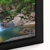 Close-up of a framed canvas featuring a textured Kentucky scenery in black with colorful art accents.